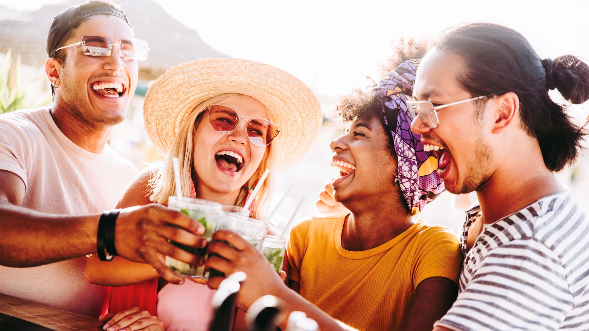 diverse group having mixed drinks