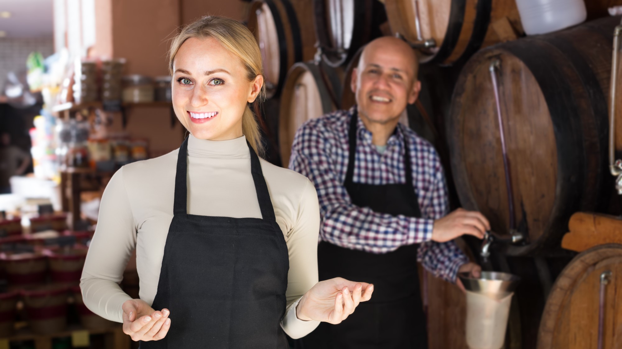 man and woman in distillery